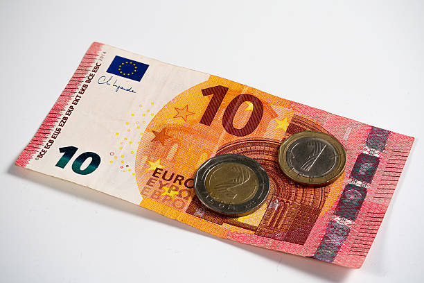 istock Ten Euro Banknote With Two Euro Coins on White Background 2229596149