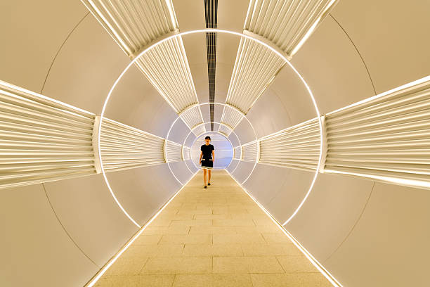 istock Woman walking in corridor tunnel 2229596498