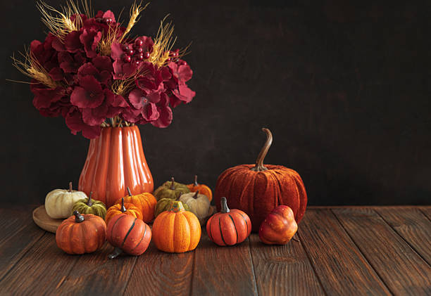 istock Autumnal composition of decorative mini pumpkins on a wooden surface. 2229604422