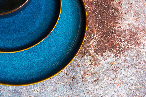 istock An abstract image of dark blue ceramic dishes. 2229607462