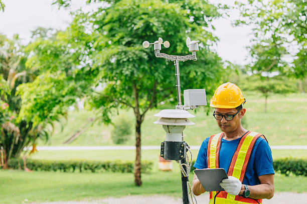 istock Man working collecting Air pollution, Weather monitor, Wind information data from sensor station 2229608676