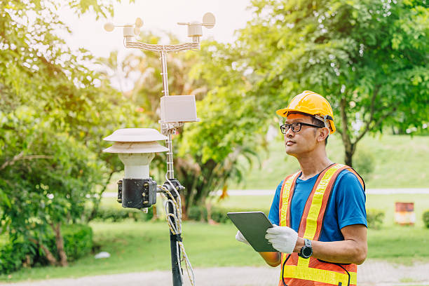 istock Man working collecting Air pollution, Weather monitor, Wind information data from sensor station 2229608678