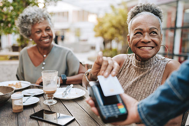 istock Senior woman making credit card payment 2229608915