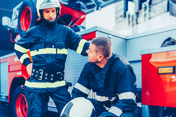 istock Firefighters resting after emergency response near fire truck 2229610101