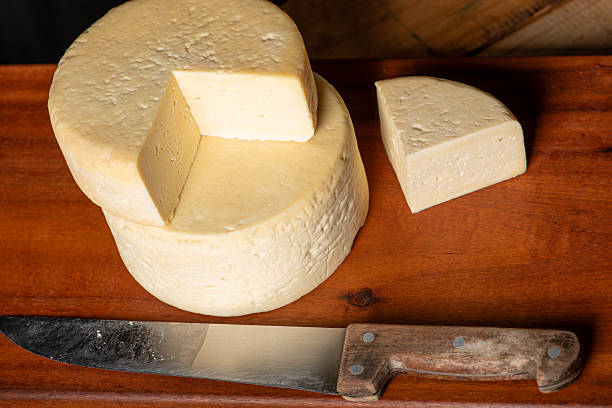 istock Semi-cured cheese made in Minas Gerais, Brazil, on a rustic surface and dark background, selective focus. 2229613266