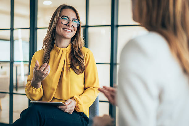 istock Two business coworkers talking 2229614289