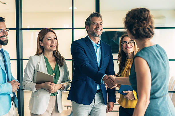 istock Business people shaking hands in the office 2229614292