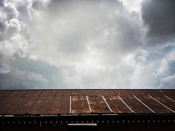 Large Rusted Tin Roof and Ominous Sky