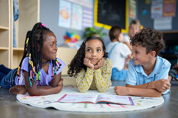 istock Diverse Group of Children Studying Together in a Classroom Environment 2229620216