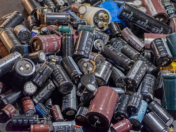 istock A diverse collection of electronic capacitors forms a complex arrangement, highlighting various types. 2229621944