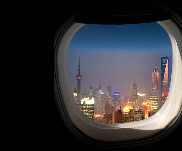 istock Shanghai , business district seen through passenger plane window. 2229622626