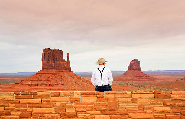USA Utah Navajo tribal park, aka Monument Valley man enjoying the scenery