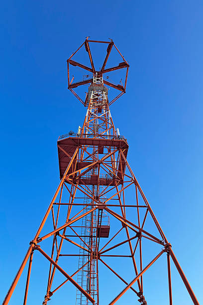 istock The communication tower stands against the sky with a bottom-up view. Close-up 2229625020