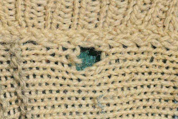 istock gray brown fabric texture from a torn woolen sweater 2229626613