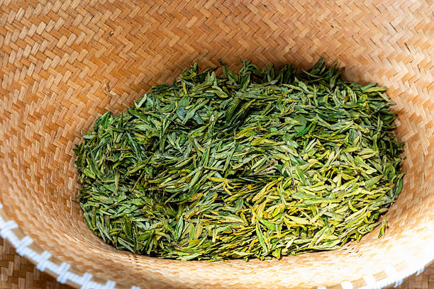 Withered longjing tea that has been pan-fried stored in rattan basket for futher drying process
