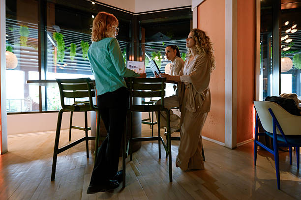 istock Business meeting in a modern workspace featuring three professional women collaborating on a project during the day 2229628946