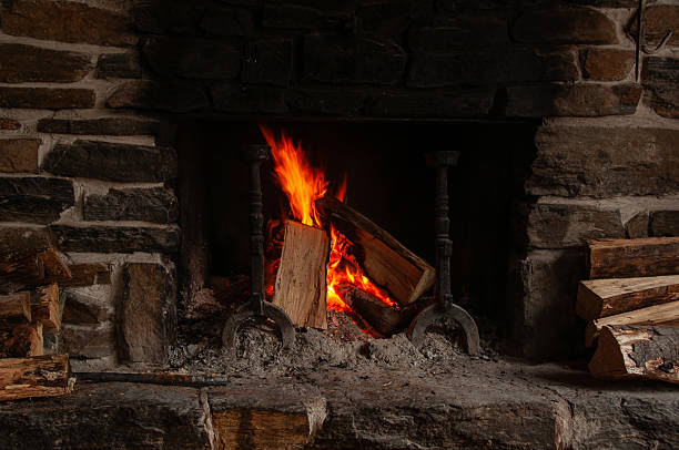 istock A warm and cozy fire burning in a rustic stone fireplace 2229633149