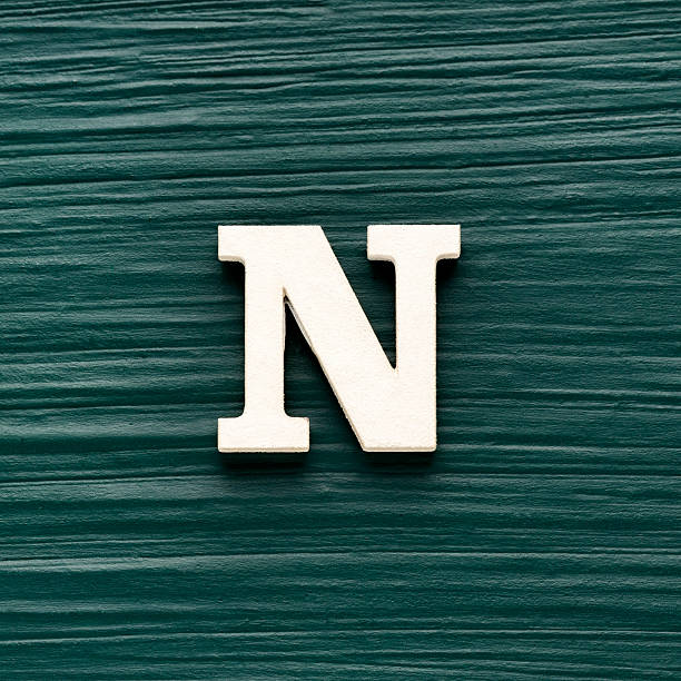 istock Capital letter N, White letter on a rustic dark green background 2229636336