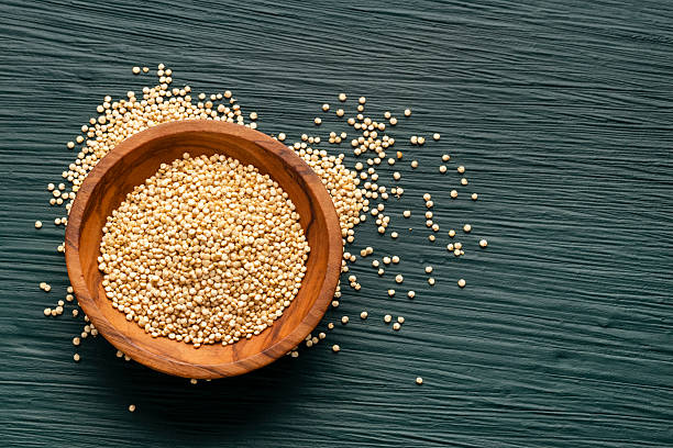 istock Raw quinoa seeds in a bowl and scattered - Chenopodium quinoa 2229636462