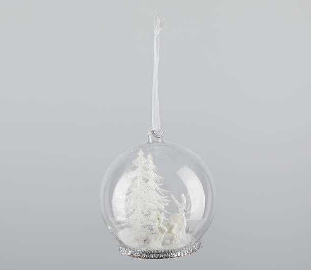 istock Christmas glass ball with two little deer inside isolated nature background with clipping path 2229643846