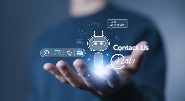 istock Hand holding AI chatbot contact support hologram with 24/7 service icons, representing artificial intelligence technology for customer service, communication, and business assistance. Smart AI contact 2229645350