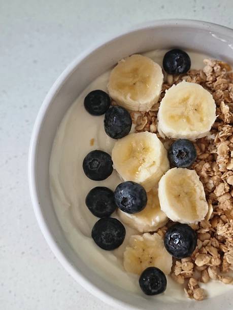 istock Fresh yogurt bowl with banana, blueberries & granola 2229647959