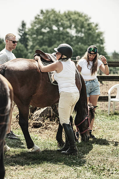 istock Mature woman getting ready for a horse ride 2229650284