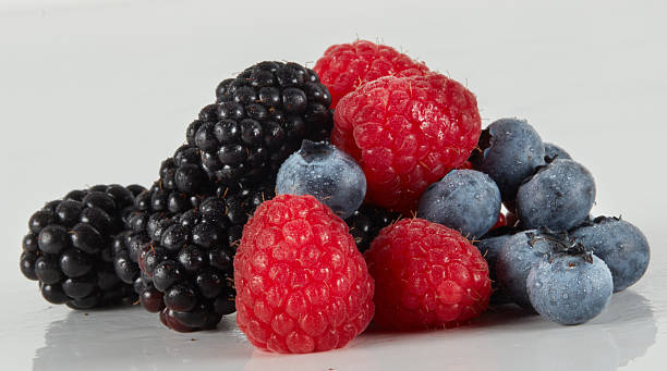 istock Fresh blackberries, blueberries, raspberries isolated nature background with clipping path 2229654193