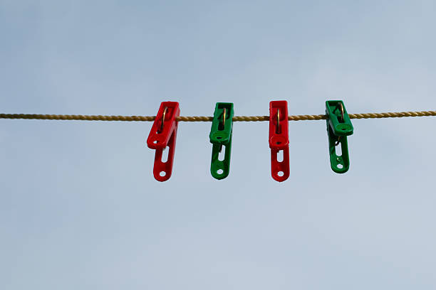 Green and red clothes pegs
