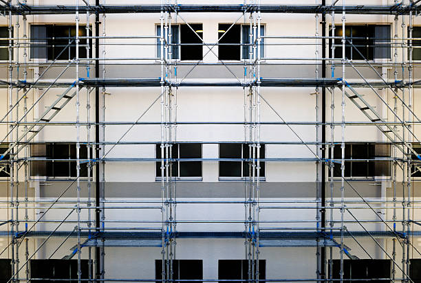 istock Abstract background of empty scaffold for repairing a building wall 2229658248