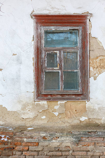 istock Old wooden window on weathered brick wall 2229658634