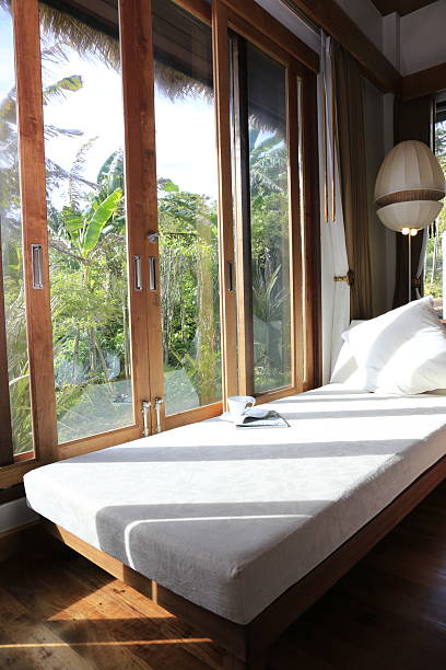 istock Reclining chairs and tall windows in resort rooms 2229660216