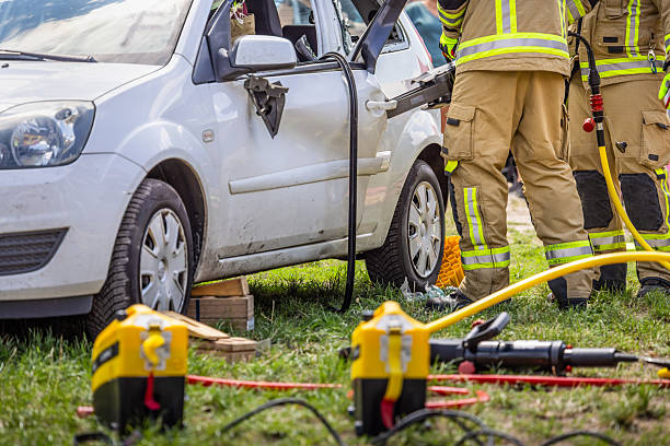Firefighters helping a car accident victim