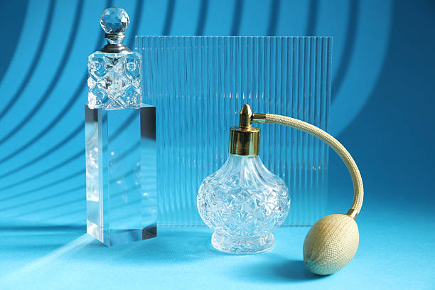 istock Stylish presentation of perfume bottles on light blue background 2229664824