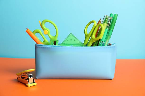 istock Pencil case with different stationery on color background 2229665856