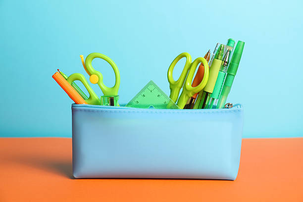 istock Different stationery in pencil case on color background 2229665908