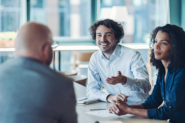 istock Group of business persons working together 2229666664