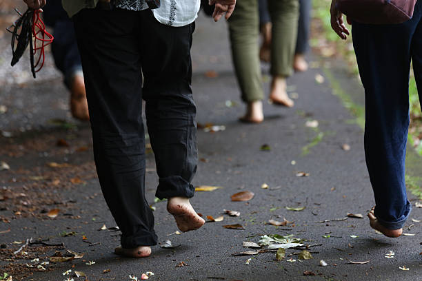 Image of a woman walking barefoot