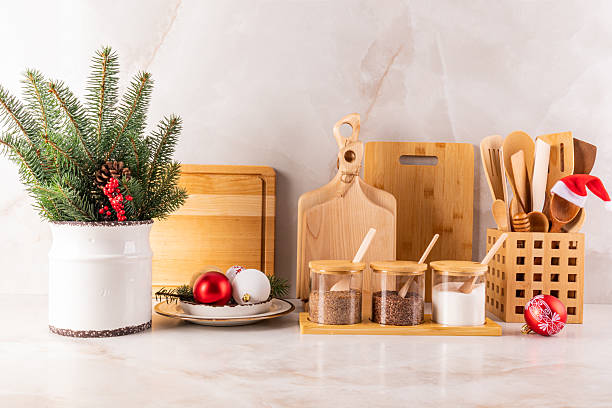 istock eco-friendly kitchen, zero waste home decorated kitchen countertop for the new year. spruce branches, balls, jars of spices, a stand with spoons. 2229668647