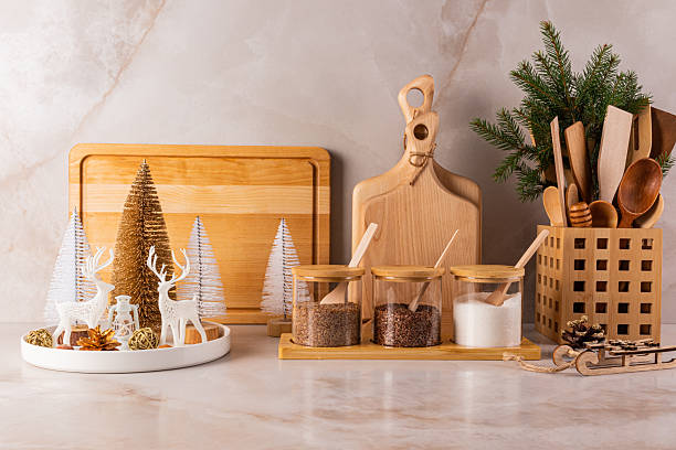 istock Beautiful stylish kitchen background with eco-friendly kitchen utensils, spice jars, cutting boards on marble countertop with Christmas decorations. 2229668652