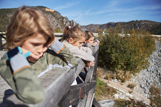 istock Beautiful children enjoying view over lake 2229668922