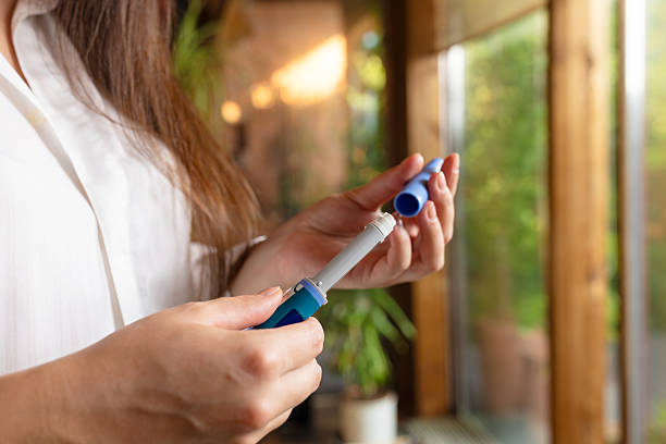 istock Woman using semaglutide injection pen. 2229672994