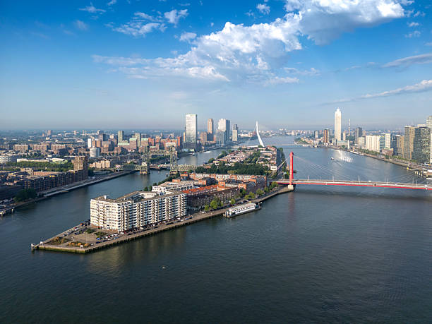 Early morning shot of the Cityscape with the “Noordereiland”.Rotterdam with it’s bridges seen from the river “Nieuwe Maas” Static drone shot.