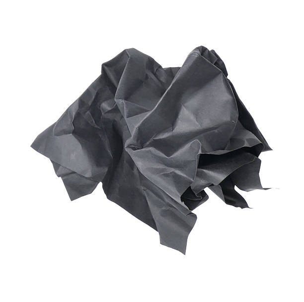 istock Crumpled black paper ball isolated on white background 2229675788