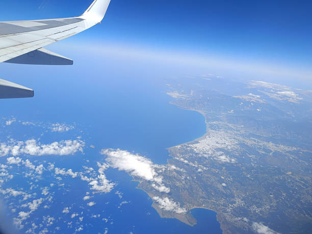 istock Aerial view from airplane window over the Mediterranean coast with wing in frame 2229675948