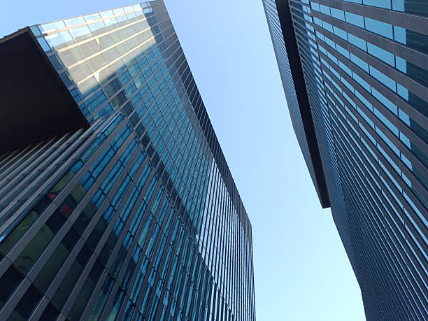 istock Modern Glass Office Buildings Against Clear Blue Sky 2229676954