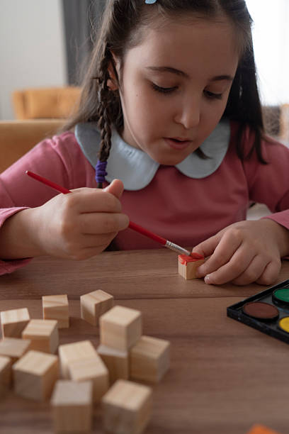 istock Girl painting cubes 2229678450