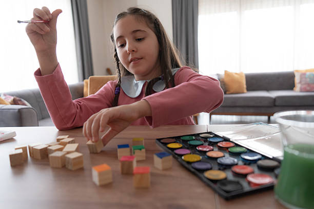 istock Girl painting cubes 2229678529