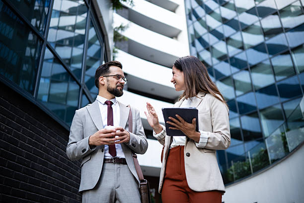 istock Businesspeople discussing work outside office building 2229678748