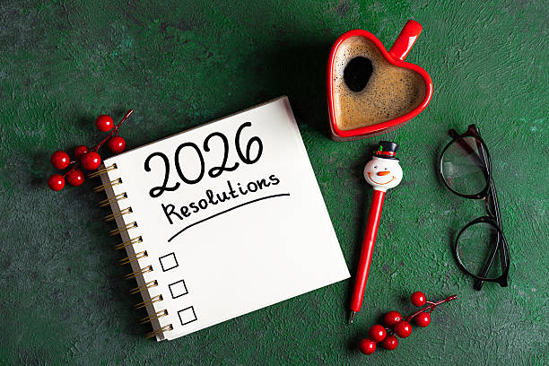 istock New year resolutions 2026 on desk. 2026 goals list with notebook, coffee cup on green table. Resolutions, plan, goals, action, checklist, idea concept. New Year 2026 resolutions 2229679035